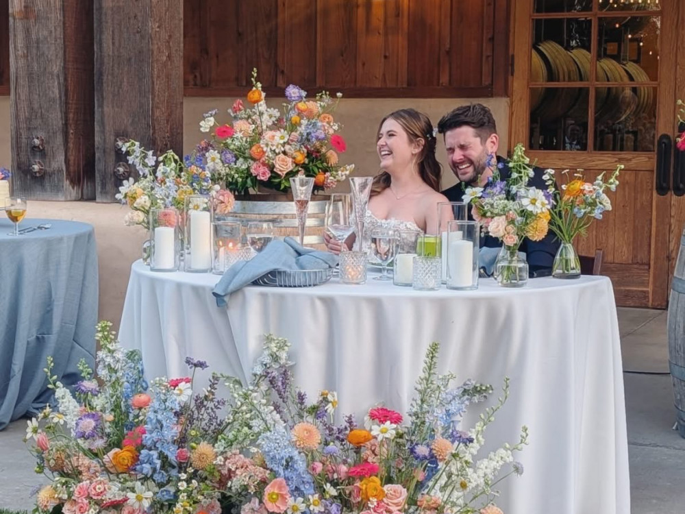 bride and groom at sweetheart table