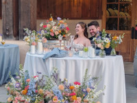 bride and groom at sweetheart table Thumbnail